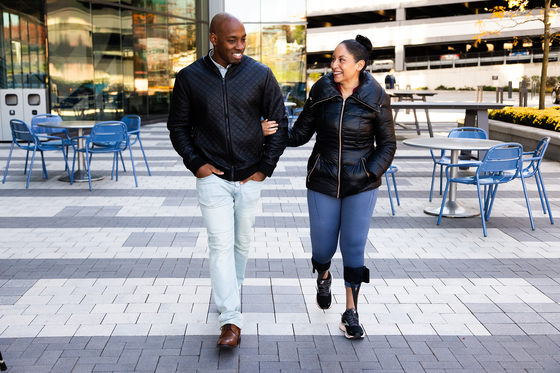 Smiling an and woman walking toward camera.